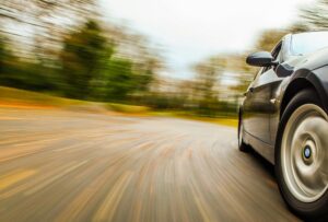 Side view of speeding car.