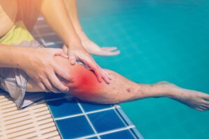 Swimmer suffering from slippery side of the pool.