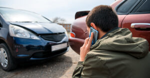 Young driver reporting for car accident.