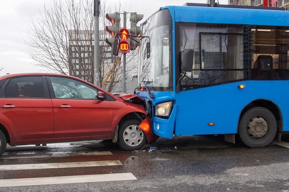 Bus vs car collision in the highway