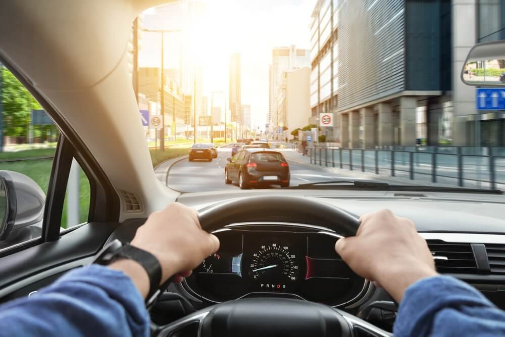 Man driving safely in the road.