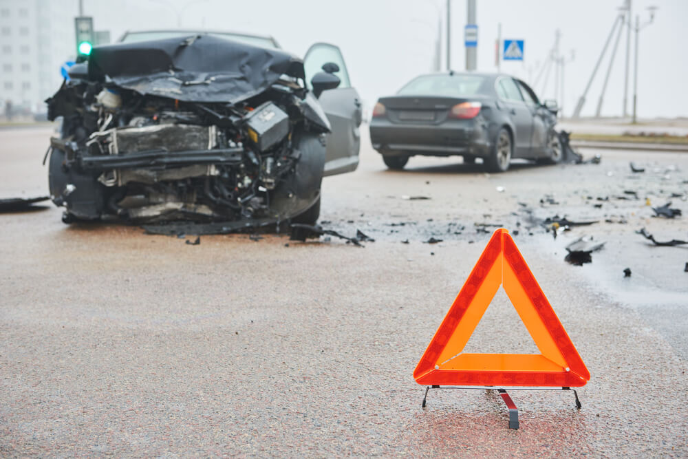 Warning sign in the highway for car collision