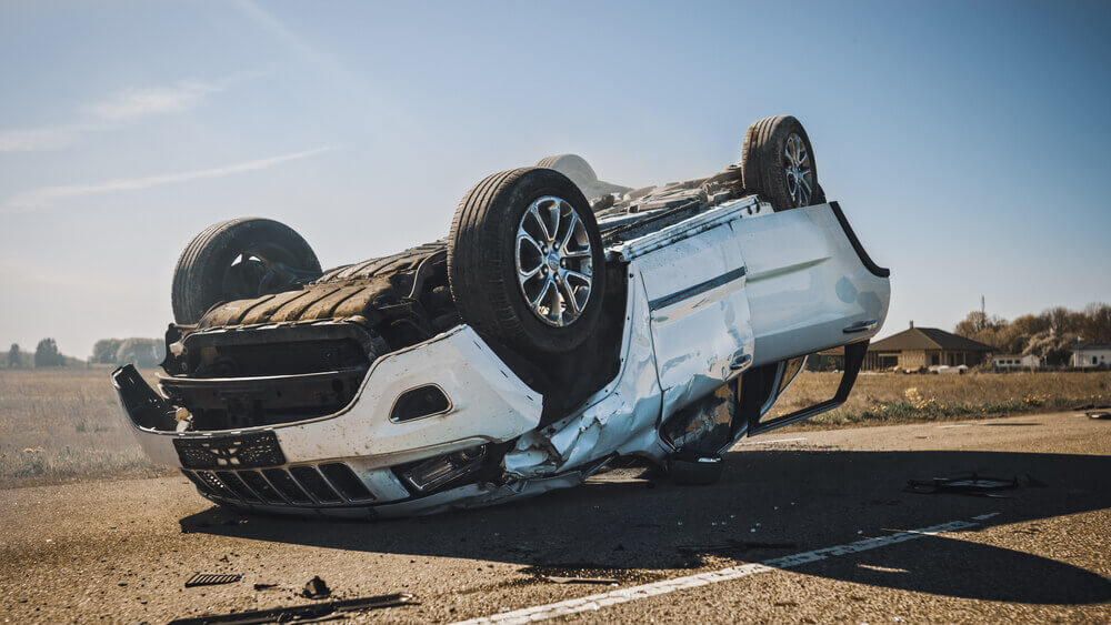 Car rollover in the middle of the road